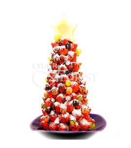 Snowstorm. Hot Holiday Special! Delicious Christmas tree made of strawberries with chocolate.